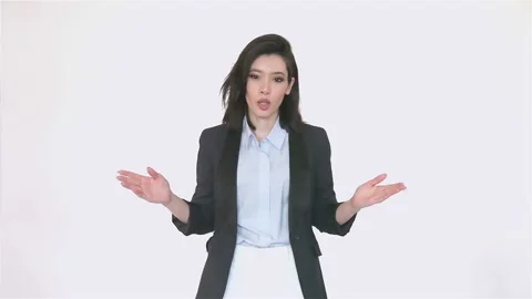 Presentable corporate woman talking to screen with serious expression 库存影片 140982853