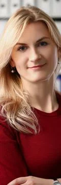 Presentable office worker smiling and posing for picture with crossed arms Stock Photos