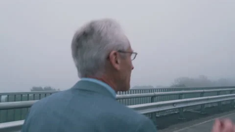 Presentable old man in suit in empty city Video stock 144577563