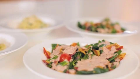 Presentation and serving of dishes, fresh colorful salad with fresh arugula and Stock Footage 80382054