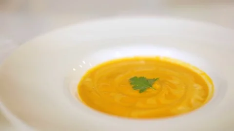 Presentation and serving of dishes from a pumpkin. soup from pumpkin, cream soup Stock Footage 80381774