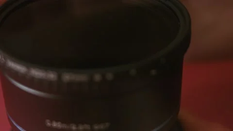 Presentation of the anomorphic lens. I put ND filter on the lens. 4k video with Stock Footage 161087967