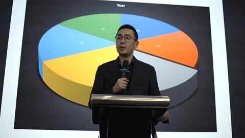 Presentation on business strategy featuring a graphical chart at a conference Stock Footage 293780291