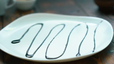 Presentation of cake on a white plate Stock Footage 67898739