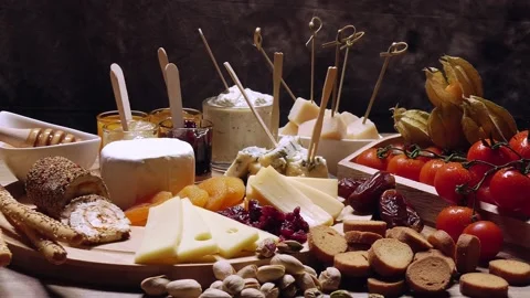 Presentation of cheeses on a wooden board Stock Footage 170561322
