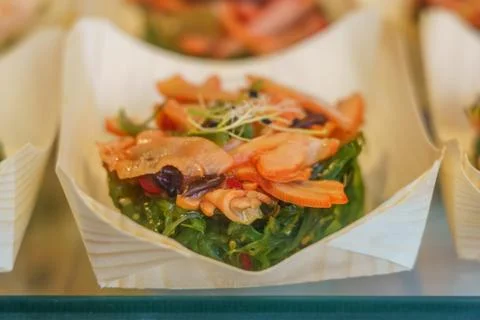 Presentation of food in small quantities, type lid, ready to consume. Fish pr Stock Photos