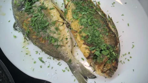 Presentation of fresh sea bream on grill pan ready to cook Stock Footage 132949917
