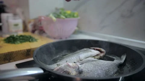 Presentation of fresh sea bream on grill pan ready to cook Stock Footage 132952131
