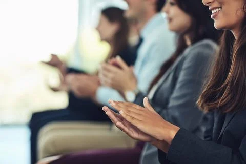 The presentation that had pleasing results. a group of businesspeople clapping Stock Photos