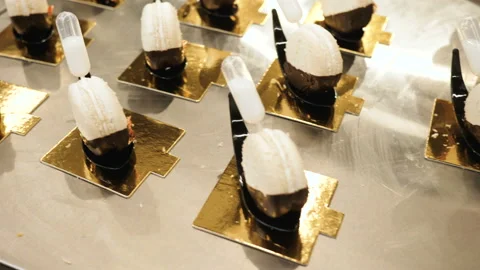 Presentation of macaroons, camera spans on macaroons of white color with half Stock Footage 98419343