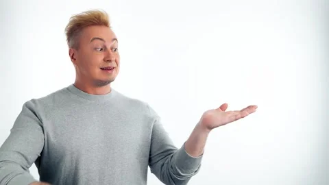 Presentation, mock up and man pointing to advertising, branding. Smiling guy mal Stock Footage 246428304