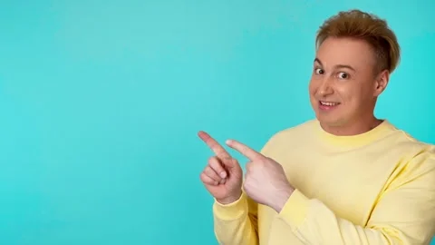 Presentation, mock up and man pointing to advertising, branding. Smiling guy mal 動画素材 246555405