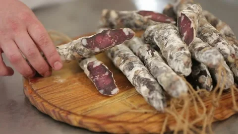 Presentation of moldy cured sausage on a board Stock Footage 146649361