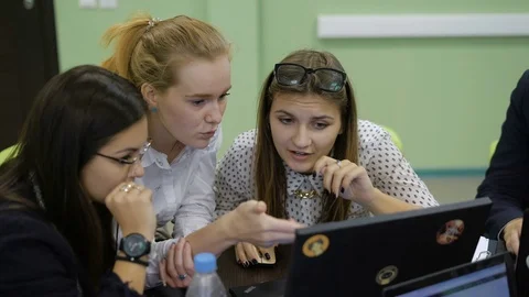 Presentation of projects in the conference hall. Young students view their Stock Footage 70933135