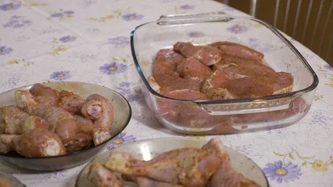 Presentation of raw pork and chicken breast seasoned in dishes on rustic tabl Stock Footage 86212565