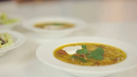 Presentation of restaurant lunch menu. Meat soup and light salad from cabbage Stock Footage 78684119