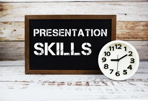 Presentation Skills text message and alarm clock on wooden background Stock Photos