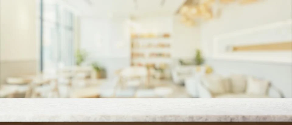 A presentation space on a white marble table with a blurred background of a.. Stock Illustration