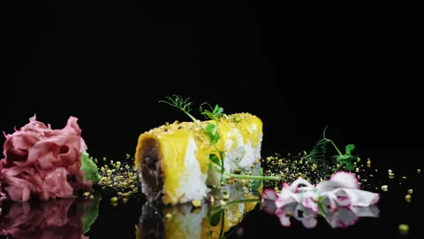 A presentation of sushi rolls stacked side by side over a black background Stock Footage 208821350