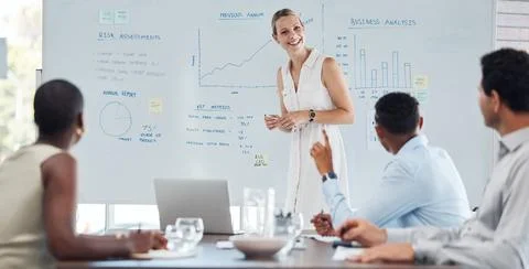 Presentation, training and data with a female leader, manager or CEO and her Stock Photos