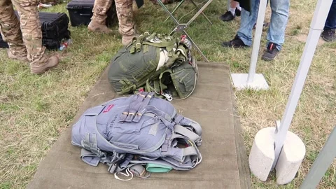 Presentation of two ready to use military parachutes used by special forces Stock Footage 244423253