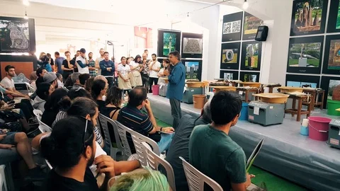 Presenter, audience and students before the pottery contest at the 12th Stock Footage 104076069