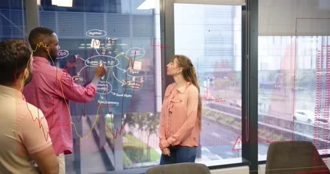 Presenter charting business flow on glass, meeting starting, animated data Stock Footage 330915997