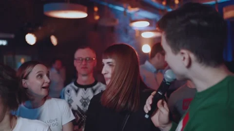 The presenter communicates with people, the toastmaster asks the guests Stock Footage 230443025