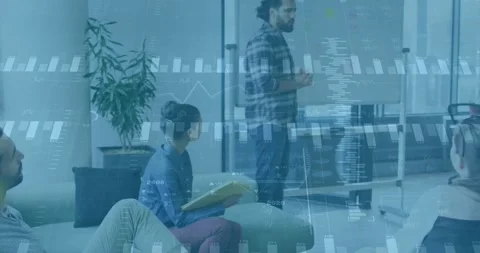Presenter entering lounge and pointing at glass board, animating charts during Stock Footage 330339193