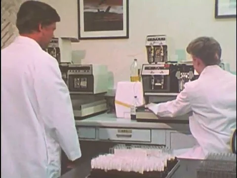 A presenter explains the checking and rechecking of urine samples, at the Air Video stock 74936511