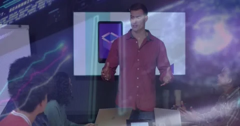 Presenter gesturing at display initiating tech talk while team noting on laptops Stock Footage 317229620