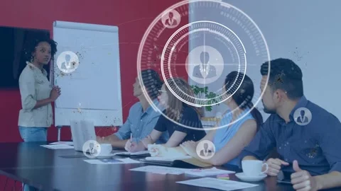 Presenter gesturing at flipchart and activating rotating HUD with user icons for Stock Footage 334185339