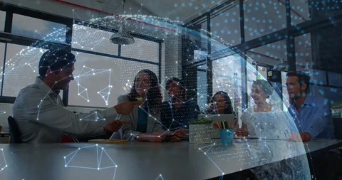 Presenter handing device to peer at table, causing network dome growth as team Stock Footage 329946673