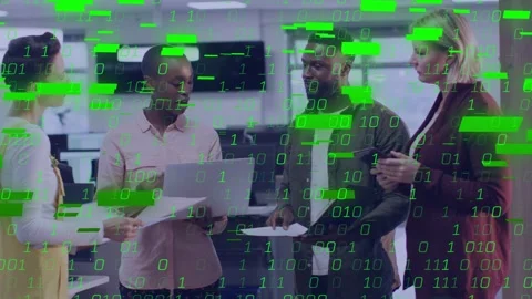 Presenter holding laptop docs, team talking, green bits overlay rising, covering Stock Footage 333062488