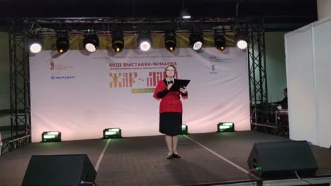 The presenter holds a festive event on stage. Stock Footage 196789965