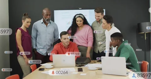 Presenter navigating laptop, business team working and reviewing chart, icons Stock Footage 333963097