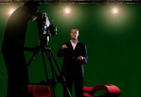 Presenter piece to camera in tv studio Stock Photos