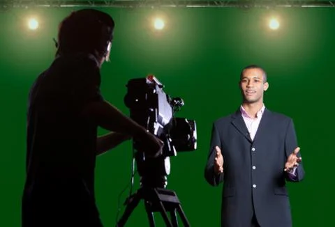 Presenter piece to camera in tv studio Photos
