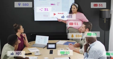 Presenter in pink pointing at screen during business pitch while social icons Stock Footage 329812721
