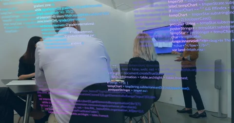 Presenter pointing at 3D screen, driving code overlay around colleagues for Stock Footage 311224561