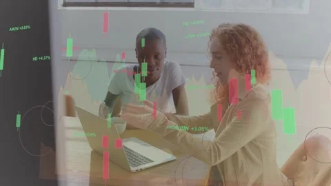 Presenter pointing and tapping laptop, starting finance demo with candles Stock Footage 332545361