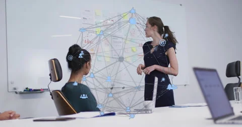 Presenter pointing at whiteboard showing network complexity with overlay in Stock Footage 316088235