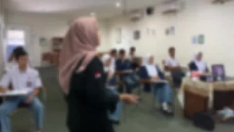 The presenter is speaking in front of the audience. Stock Footage 256858748
