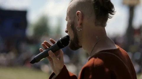 Presenter speaks into the microphone Stock Footage 82357523