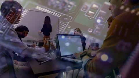Presenter starting whiteboard notes tech team typing on laptop planning circuit Stock Footage 334466493
