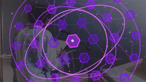 Presenter stepping to mic, starting purple hex overlay expanding, obscuring Stock Footage 331025007