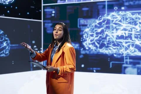 Presenter talks with spectators at AI convention bringing together professionals 스톡 사진