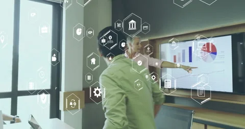 Presenter tapping display controls, updating sales subscription charts while Stock Footage 314906370