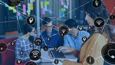 Presenter tapping laptop in design meeting, initiating animated node network 動画素材 333704173