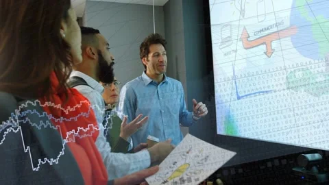Presenter tapping screen team leaning in and analyzing animated flight maps, Video stock 333873751